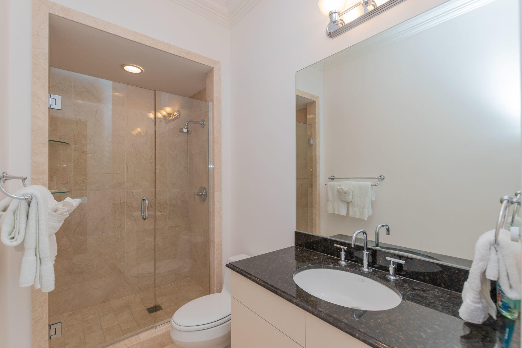281 Trumbo Road, Unit 205 Key West, FL 33040 - Photo 17 of 35 a bathroom with a granite countertop sink toilet a mirror and shower