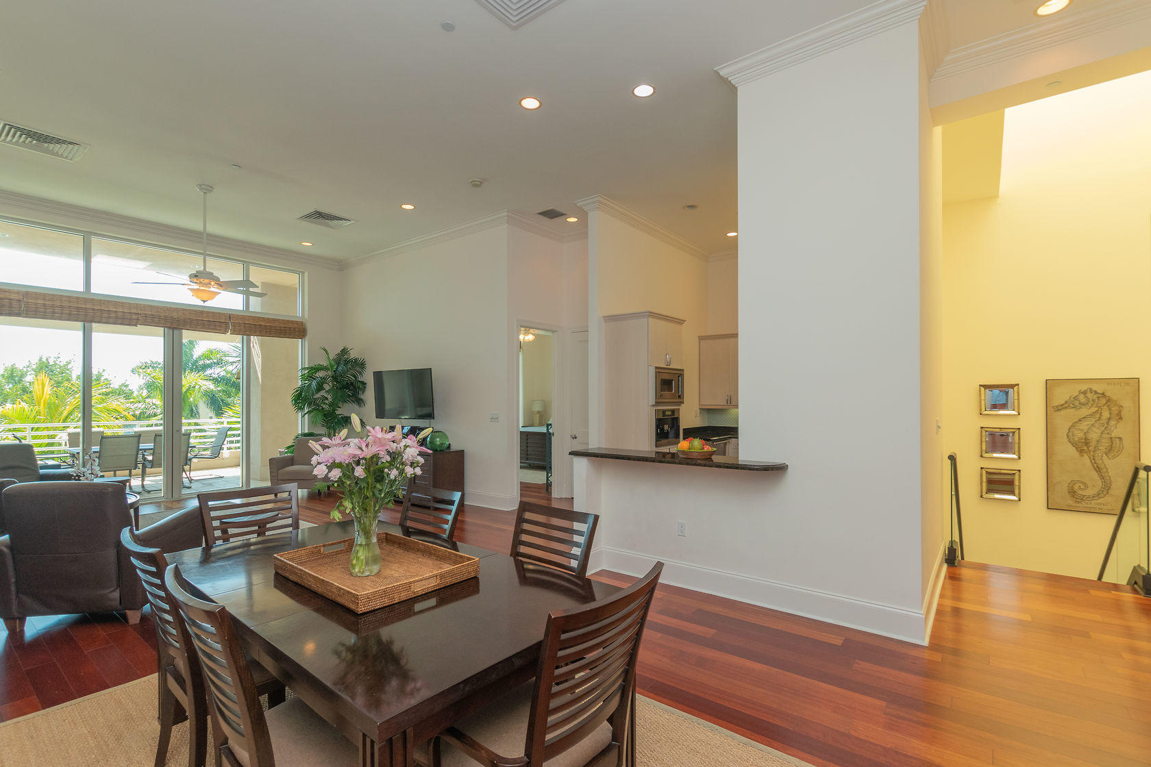 281 Trumbo Road, Unit 205 Key West, FL 33040 - Photo 18 of 35 a dining room with furniture and wooden floor