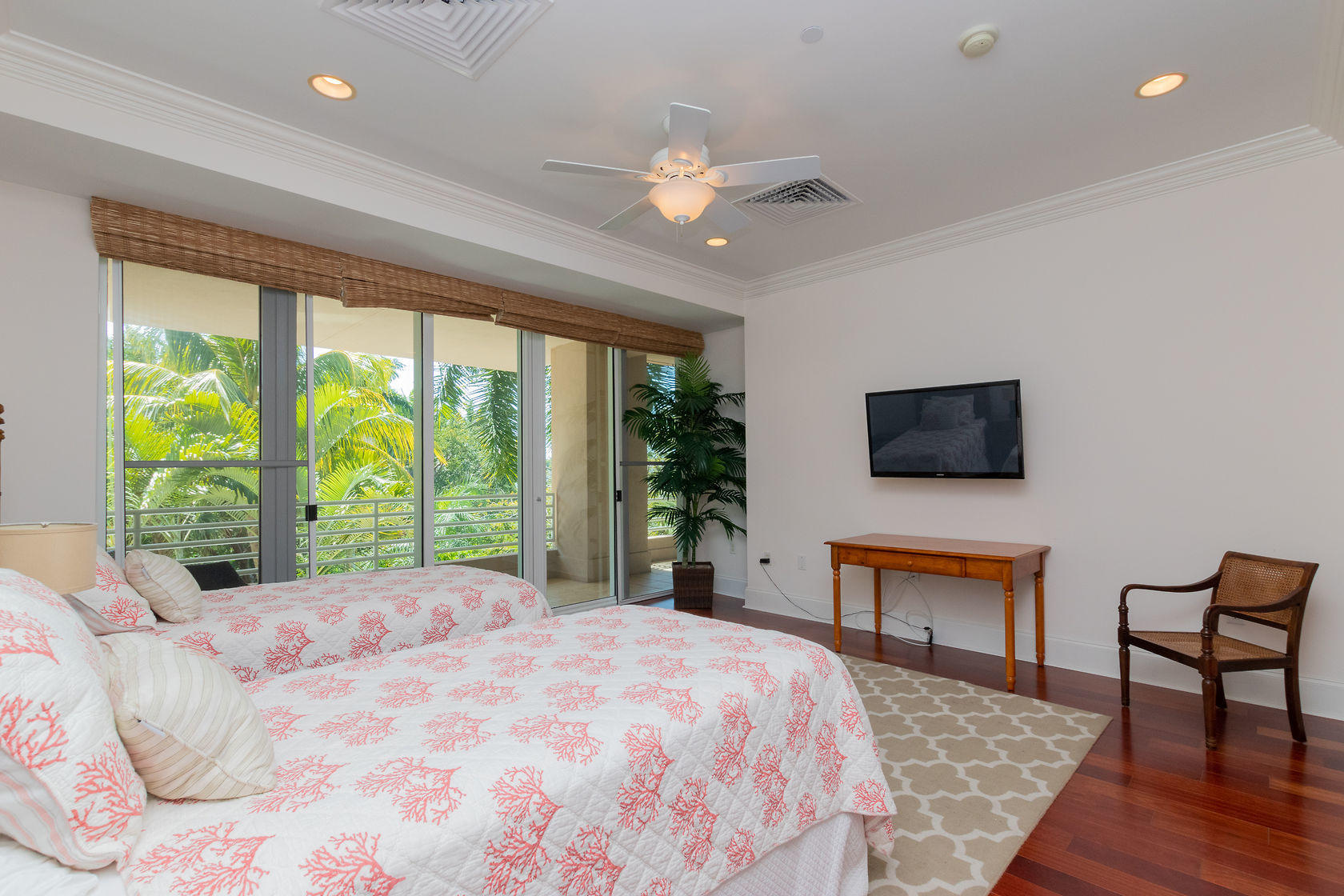 281 Trumbo Road, Unit 205 Key West, FL 33040 - Photo 23 of 35 a bed sitting in a spacious bedroom next to a window and a flat screen tv