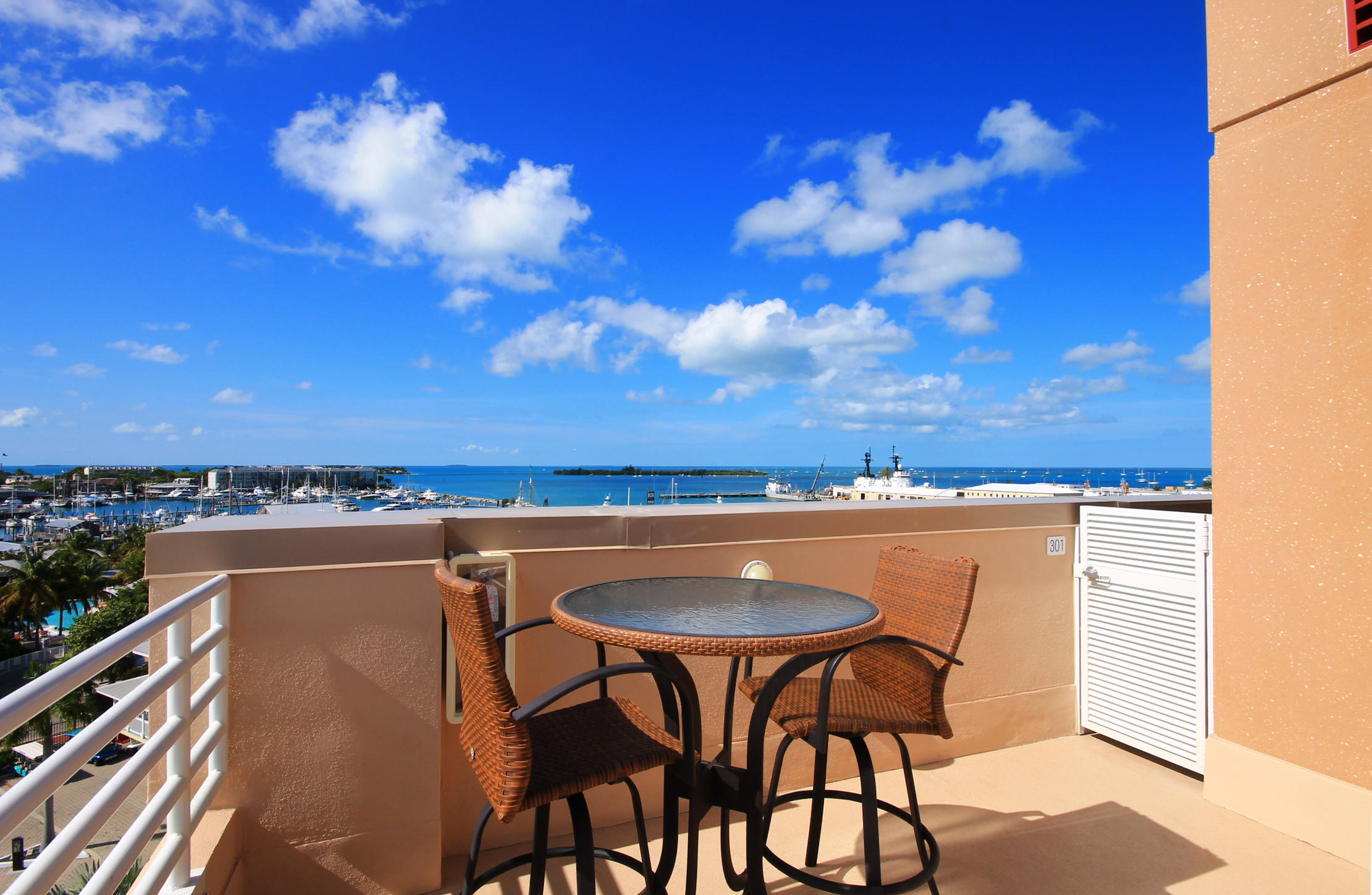 281 Trumbo Road, Unit 205 Key West, FL 33040 - Photo 30 of 35 a view of a chairs and table in a terrace