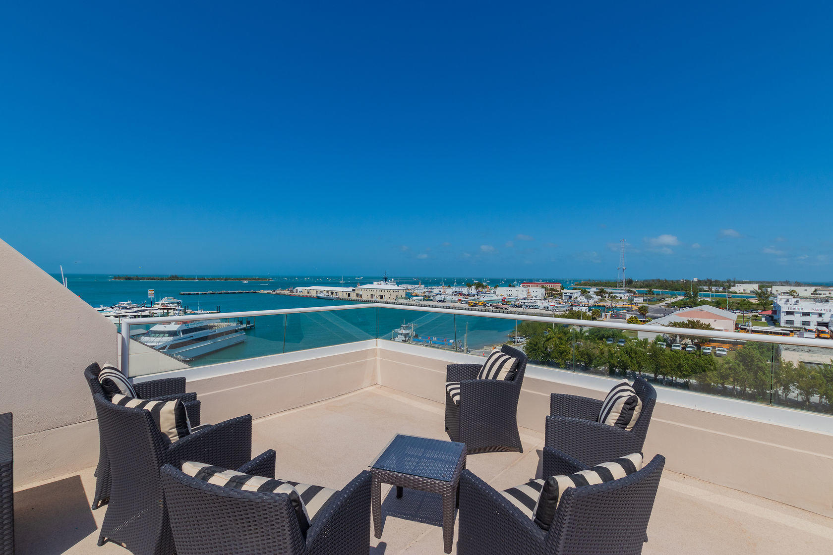 281 Trumbo Road, Unit 205 Key West, FL 33040 - Photo 33 of 35 a view of a chairs and table in the terrace