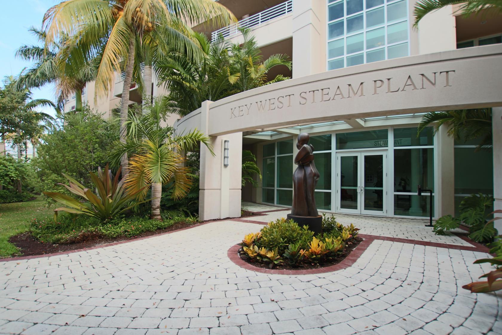 281 Trumbo Road, Unit 205 Key West, FL 33040 - Photo 8 of 35 a front view of a building with garden