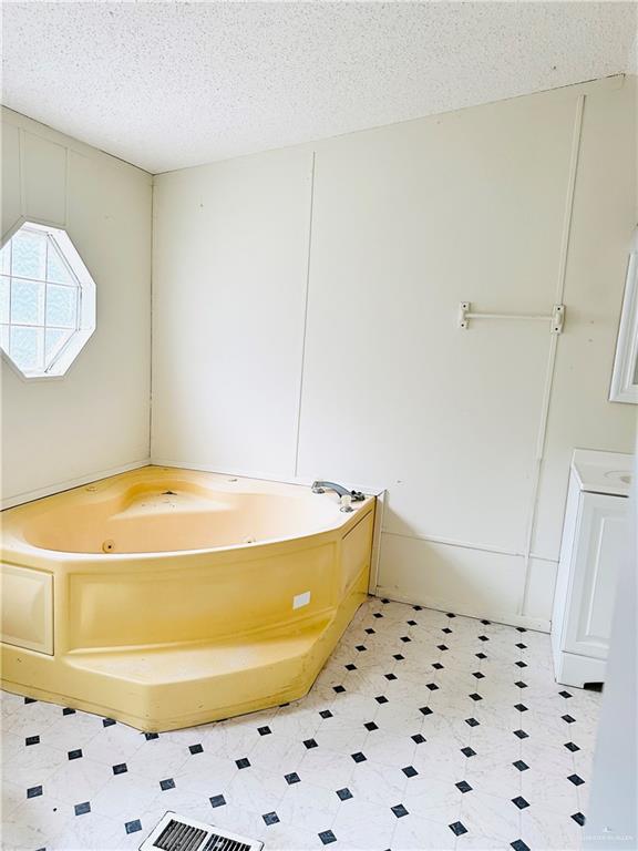 2408 Verbena Avenue Edinburg, TX 78542 - Photo 11 of 19 a bathroom with a bathtub and a shower