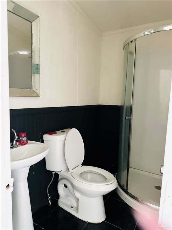 2408 Verbena Avenue Edinburg, TX 78542 - Photo 16 of 19 a bathroom with a sink and a mirror