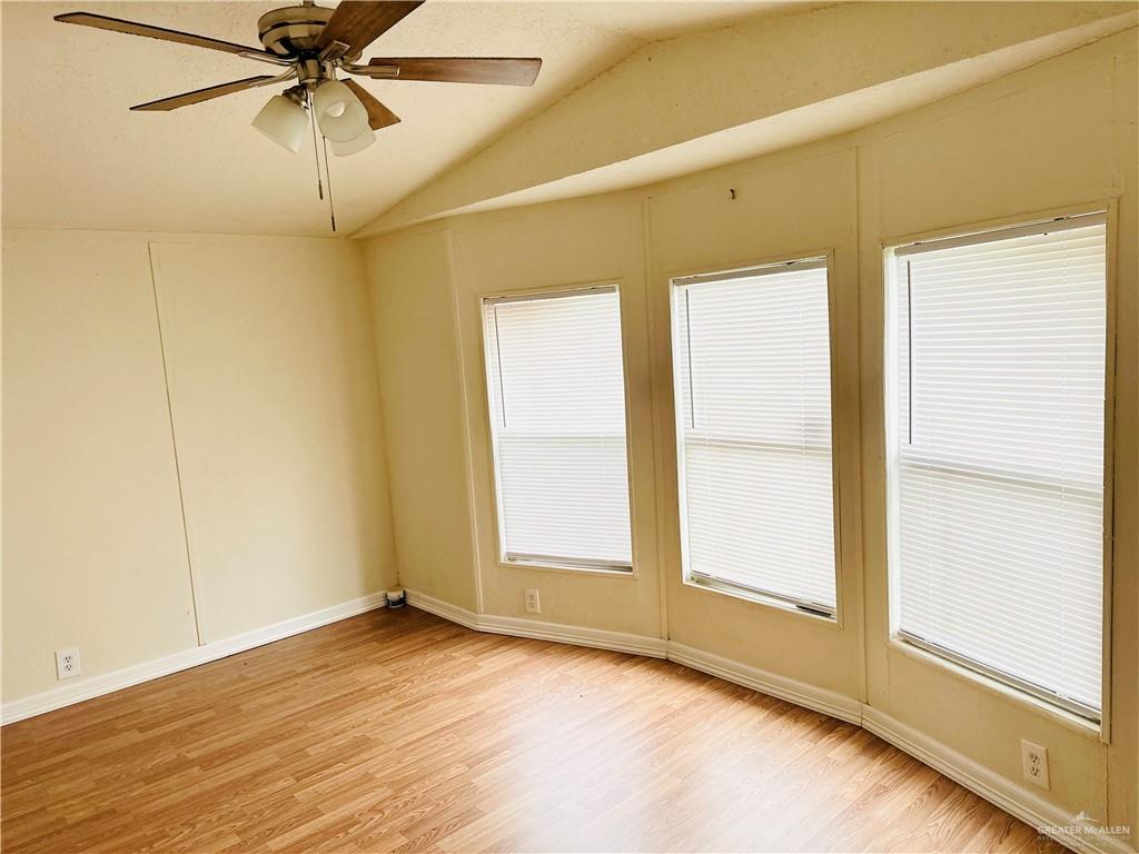 2408 Verbena Avenue Edinburg, TX 78542 - Photo 19 of 19 a view of a room with a window and wooden floor