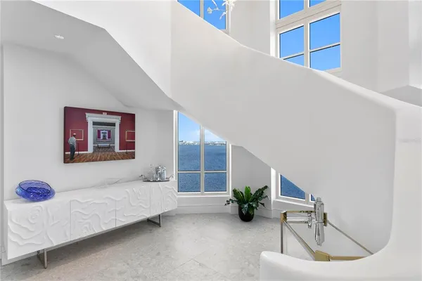 a dining room with furniture and a window