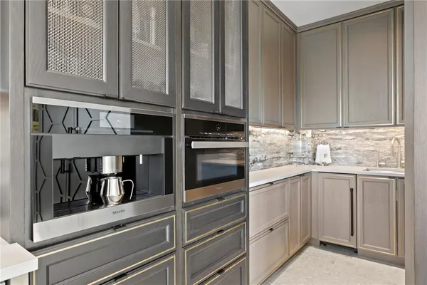 a bedroom with a bed and glass door