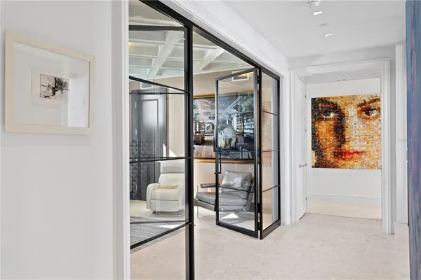 a bedroom with a bed and a potted plant