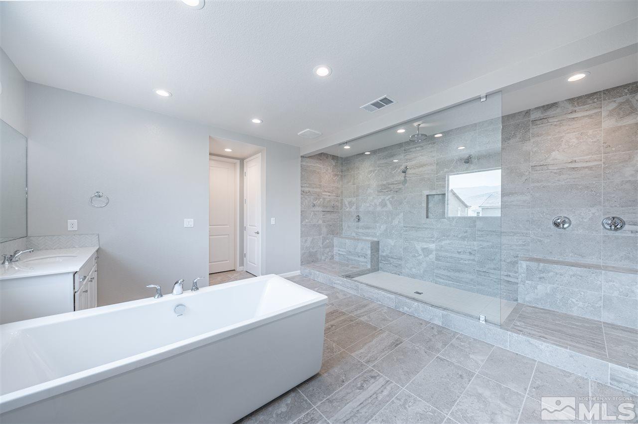 9276 Perceval Way, Unit HOMESITE 51 Reno, NV 89521 - Photo 13 of 21 a bathroom with a bathtub and shower