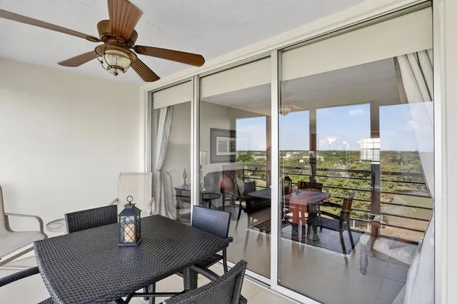 a view of a dining room with furniture and window