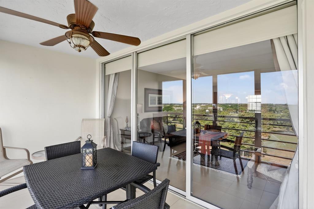 605 Oaks Drive, Unit 1008 Pompano Beach, FL 33069 - Photo 23 of 30 a view of a dining room with furniture and window