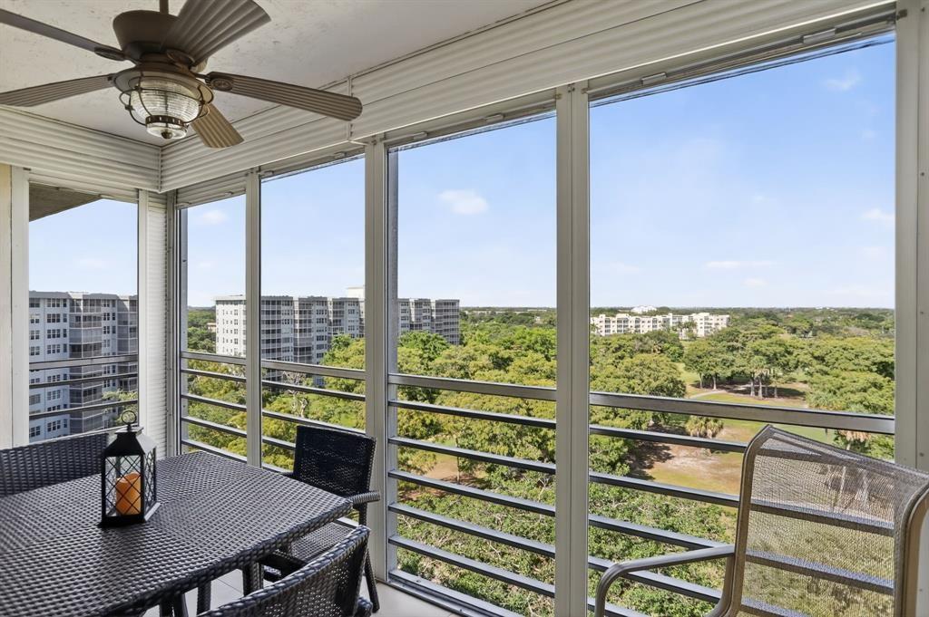 605 Oaks Drive, Unit 1008 Pompano Beach, FL 33069 - Photo 24 of 30 a view of a dining room with furniture window and outside view