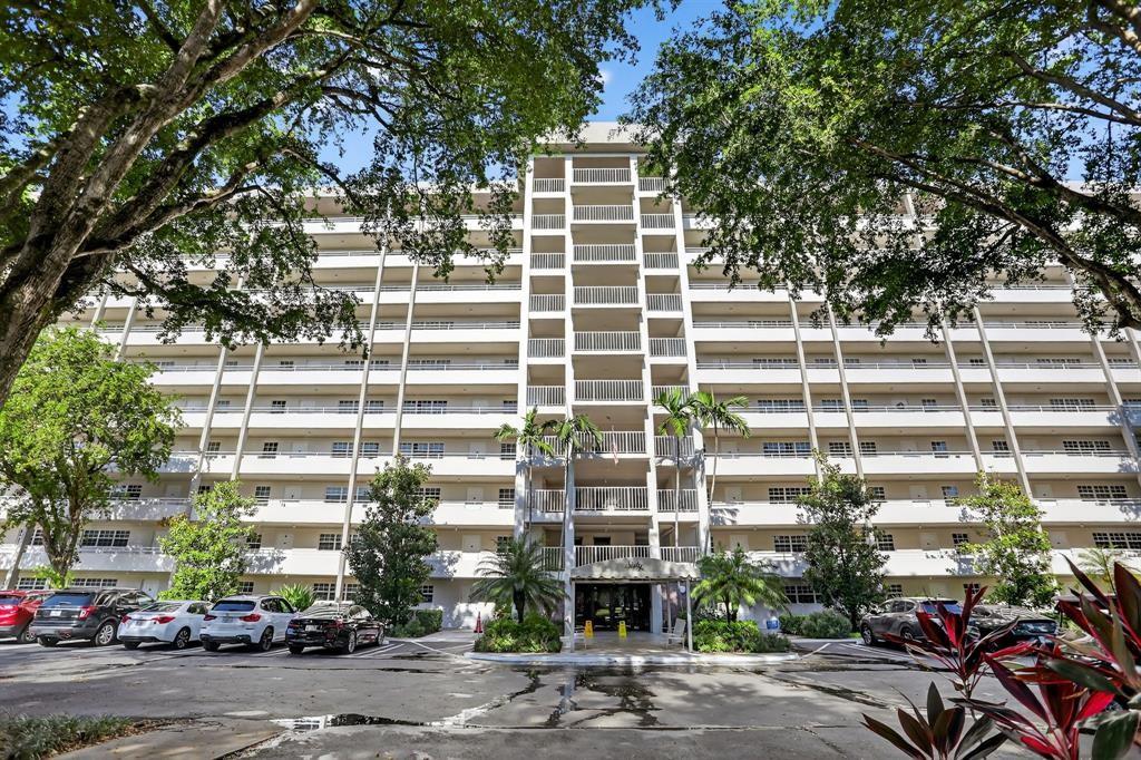 605 Oaks Drive, Unit 1008 Pompano Beach, FL 33069 - Photo 25 of 30 a front view of a building with a street