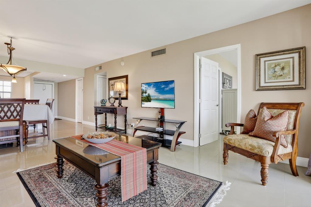 605 Oaks Drive, Unit 1008 Pompano Beach, FL 33069 - Photo 8 of 30 a living room with furniture and a wooden floor