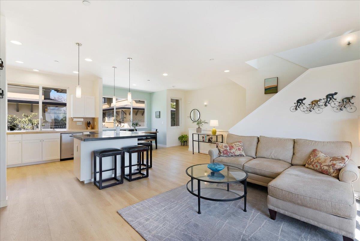 117 Gault Street, Unit B Santa Cruz, CA 95062 - Photo 11 of 42 a living room with couches and kitchen view with wooden floor