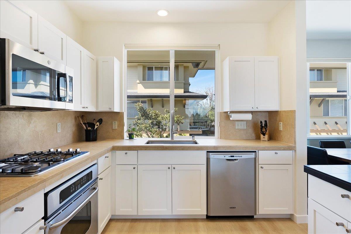 117 Gault Street, Unit B Santa Cruz, CA 95062 - Photo 15 of 42 a kitchen with stainless steel appliances granite countertop a stove and a sink