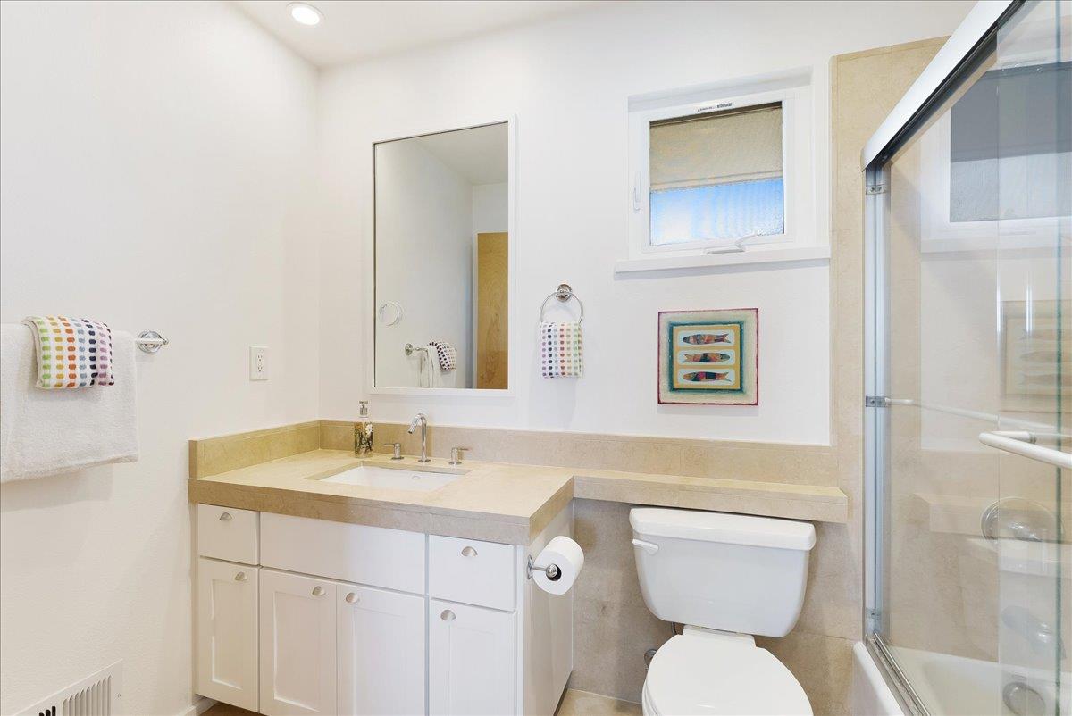 117 Gault Street, Unit B Santa Cruz, CA 95062 - Photo 23 of 42 a bathroom with a toilet sink and mirror
