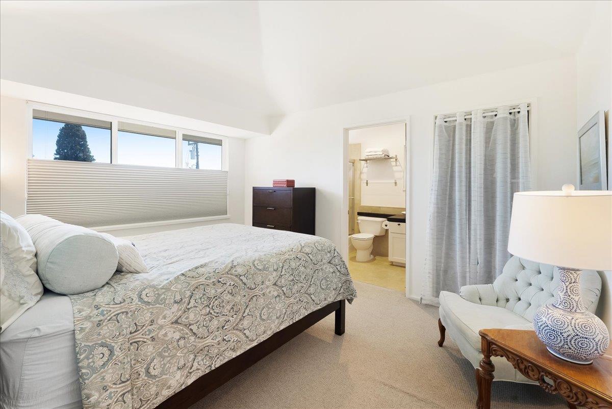 117 Gault Street, Unit B Santa Cruz, CA 95062 - Photo 27 of 42 a bedroom with a bed and chair