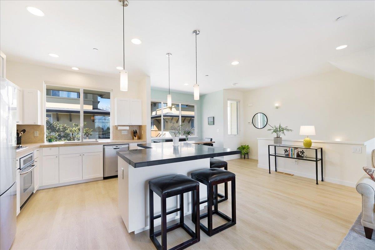 117 Gault Street, Unit B Santa Cruz, CA 95062 - Photo 9 of 42 a large kitchen with a lot of counter space and a wooden floor
