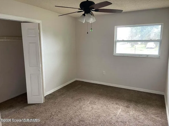 a view of a lake with a swimming pool and mountain view