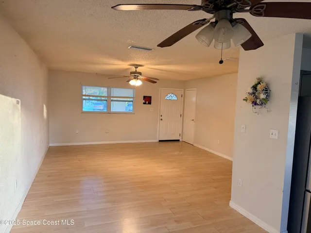 a view of a refrigerator in a kitchen
