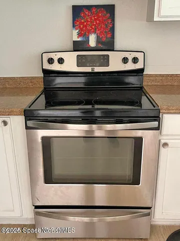a bathroom with a double vanity sink mirror and shower
