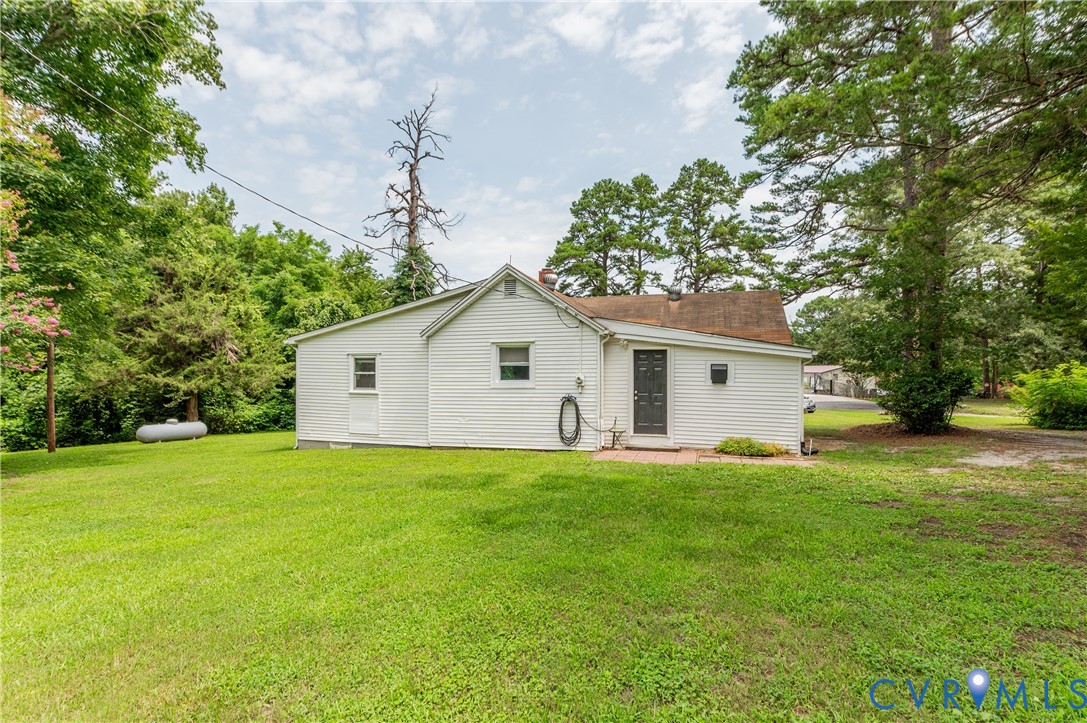 661 CCC Road Crewe, VA 23930 - Photo 33 of 38 Expansive green lawn bordering the white siding st