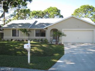17552 Ingram Road Fort Myers, FL 33967 - Photo 1 of 5 a front view of house with yard