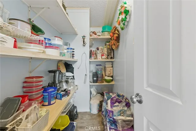 a bedroom with a bed chair and piano