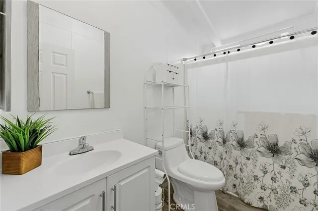 a bed room with a bed and a window