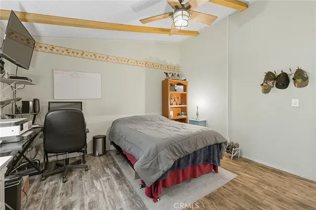 a dining room with furniture and a potted plant