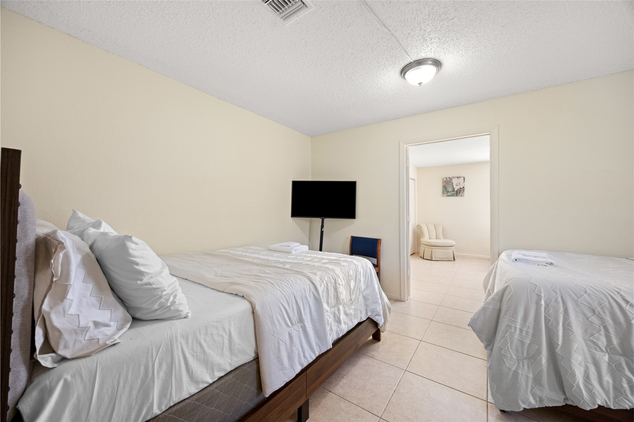 25231 Roesner Lane Katy, TX 77494 - Photo 12 of 48 a bedroom with a bed and flat screen tv