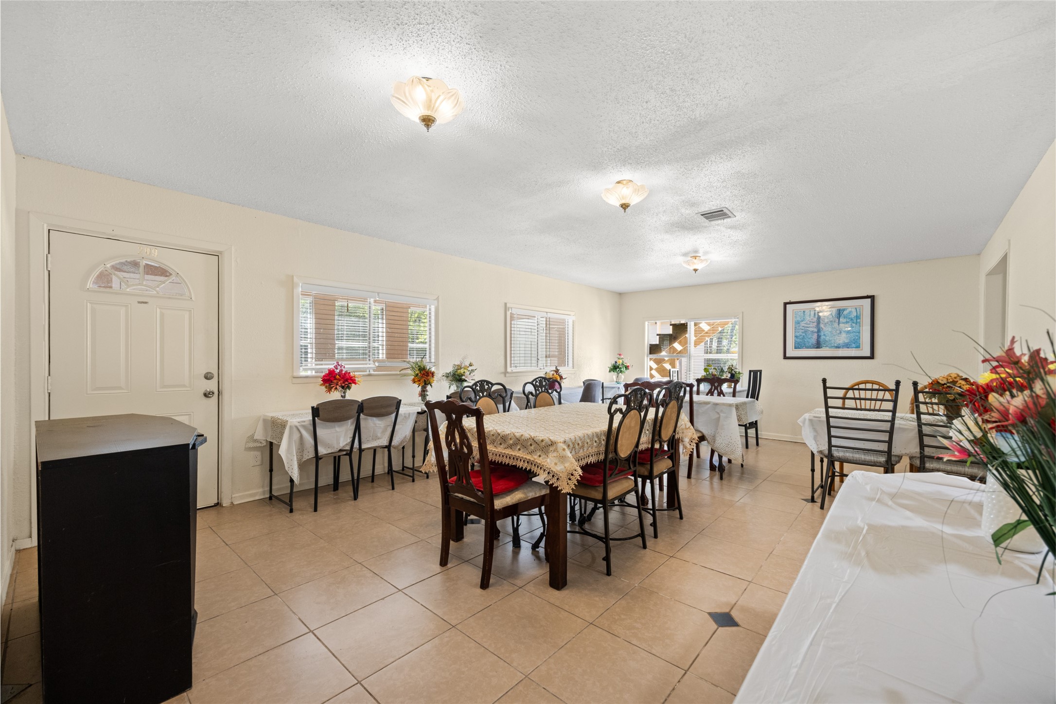 25231 Roesner Lane Katy, TX 77494 - Photo 15 of 48 a view of a dining room with furniture and chandelier