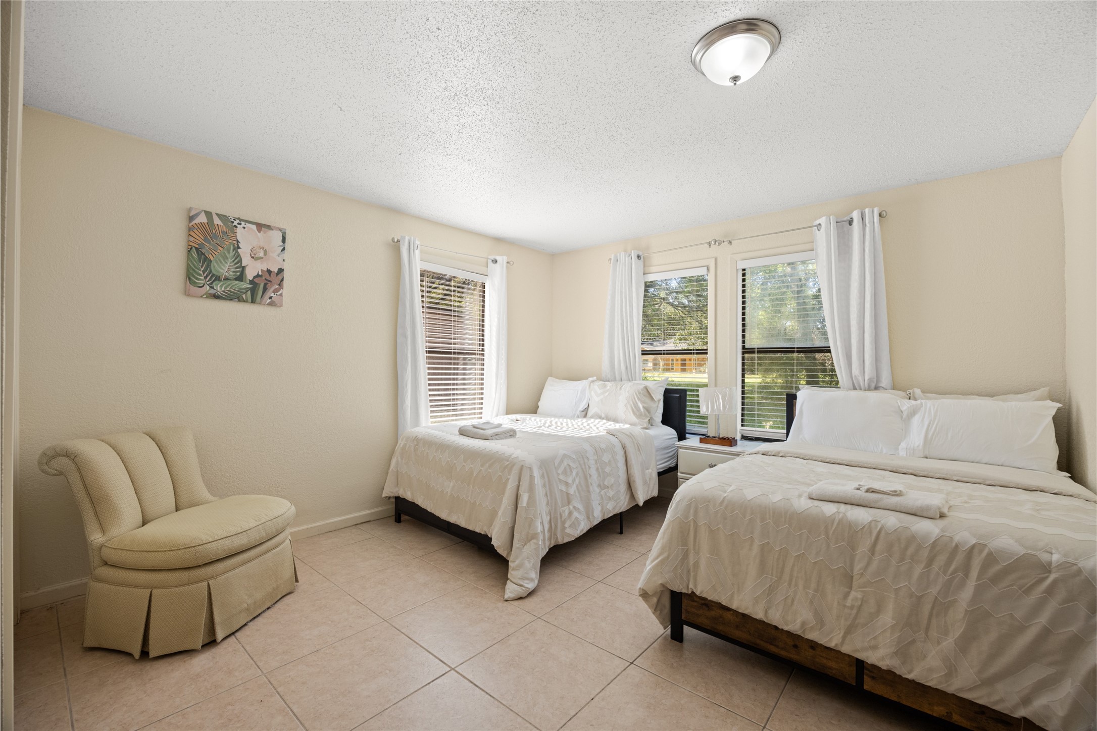 25231 Roesner Lane Katy, TX 77494 - Photo 18 of 48 a spacious bedroom with two beds and a couch