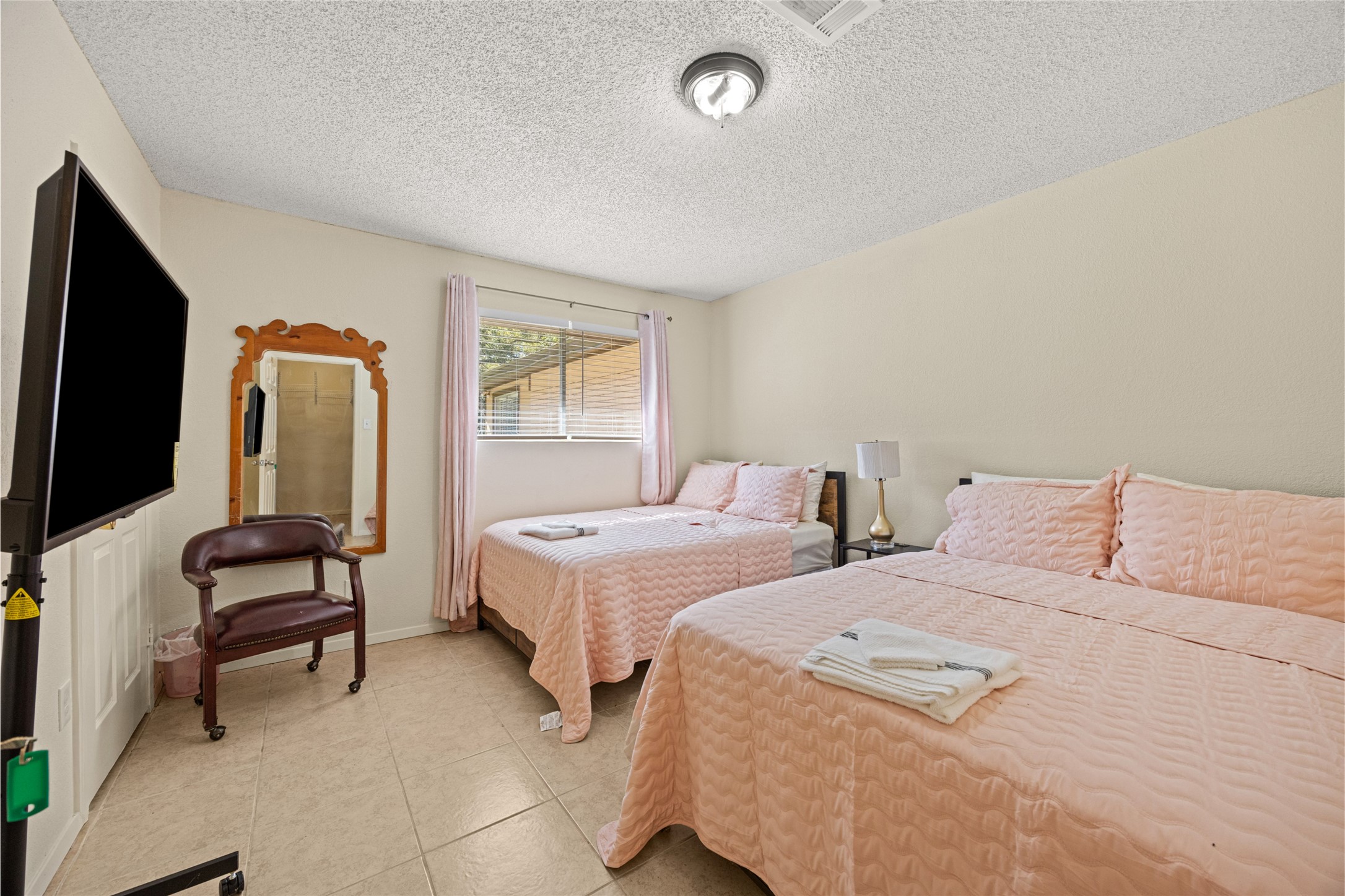 25231 Roesner Lane Katy, TX 77494 - Photo 25 of 48 a bedroom with two beds and a flat screen tv