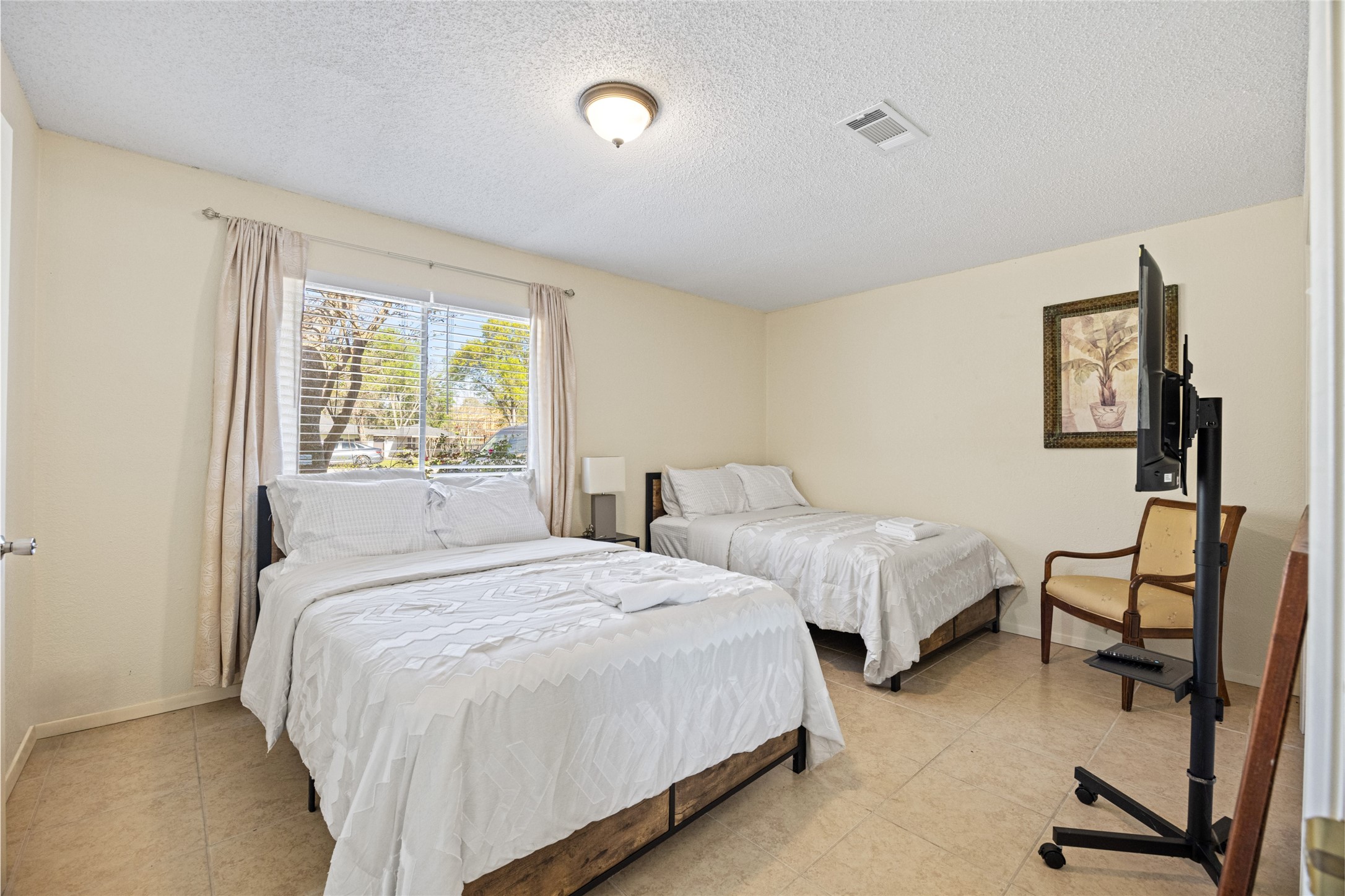 25231 Roesner Lane Katy, TX 77494 - Photo 28 of 48 a bedroom with two beds and a window