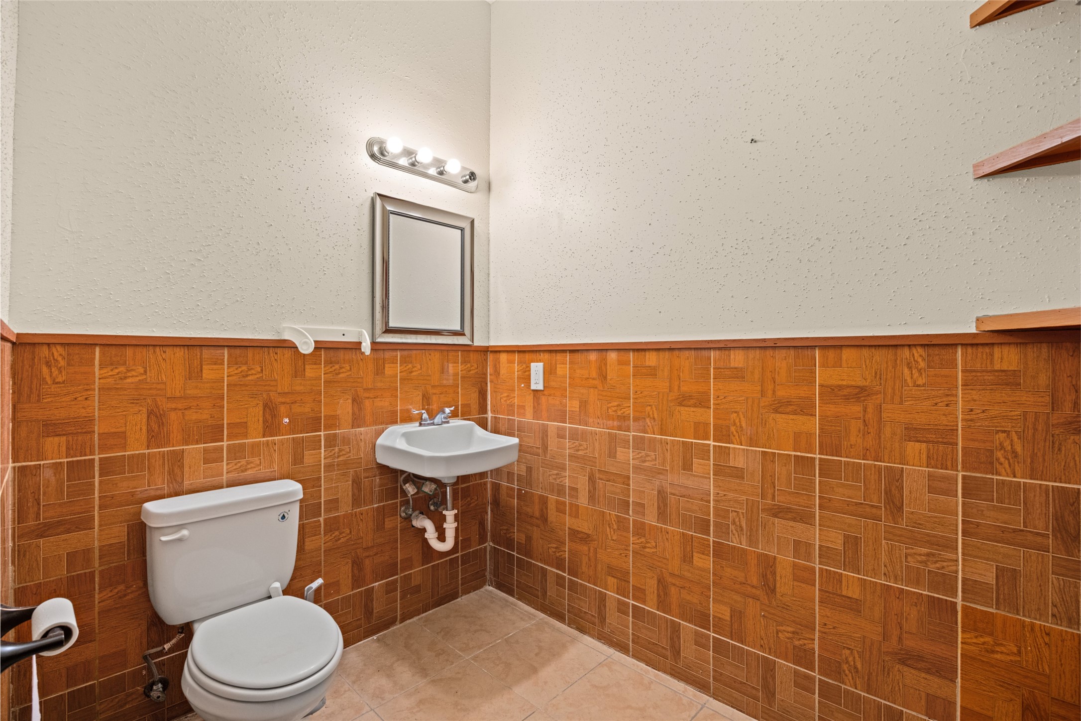 25231 Roesner Lane Katy, TX 77494 - Photo 39 of 48 a bathroom with a toilet a sink and a mirror