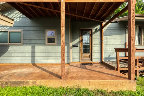 a view of a bedroom with bed and furniture