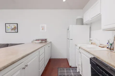 a bed room with a bed and a dresser