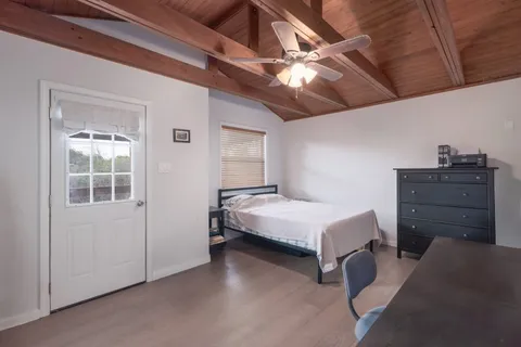 a bedroom with a bed and dresser