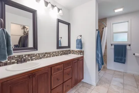 a bathroom with a bathtub and shower