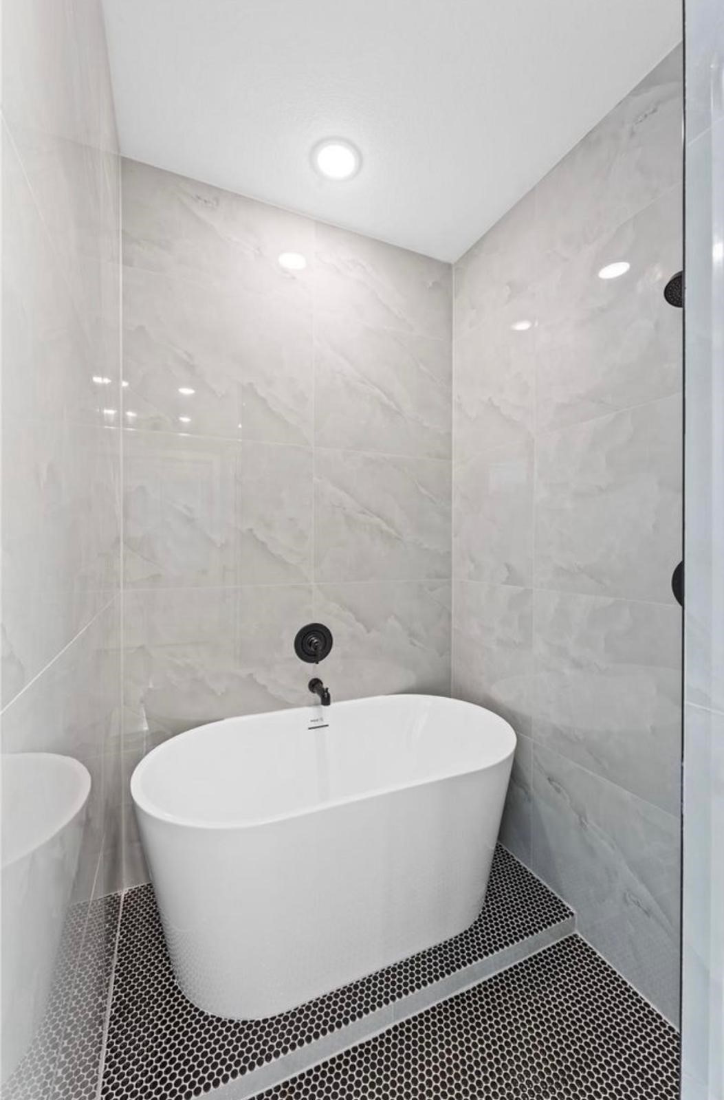 2606 Liguria Ln Spring Spring, TX 77388 - Photo 14 of 29 a white bath tub sitting in a bathroom