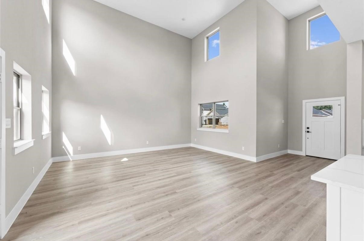 2606 Liguria Ln Spring Spring, TX 77388 - Photo 29 of 29 a view of an empty room with window and wooden floor