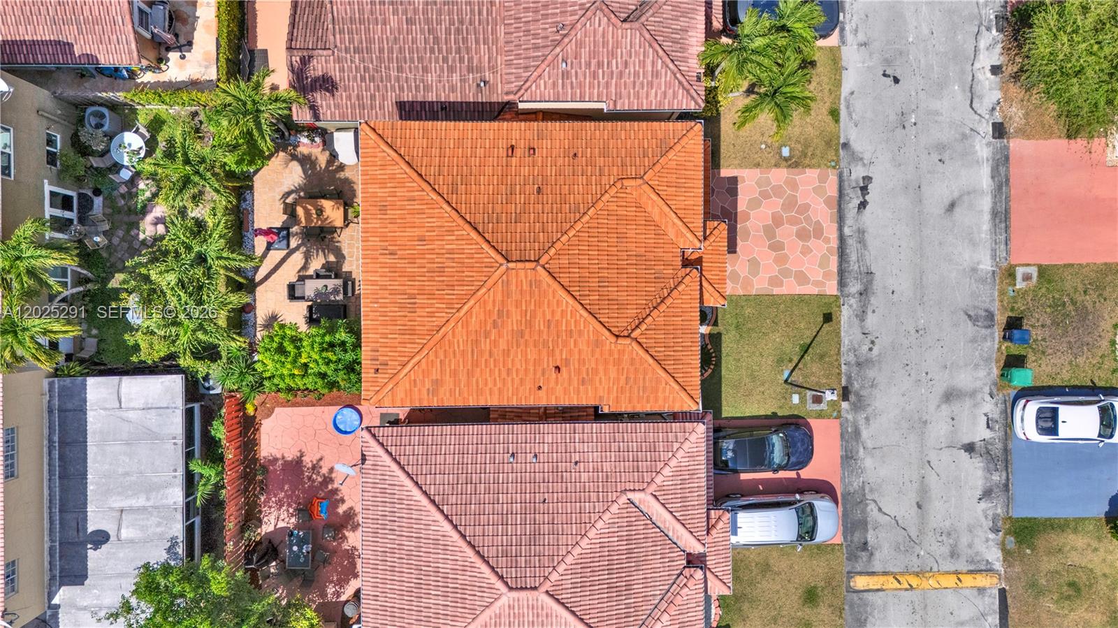 10006 Southwest 162nd Path Miami, FL 33196 - Photo 35 of 40 an aerial view of a house with a yard and potted plants