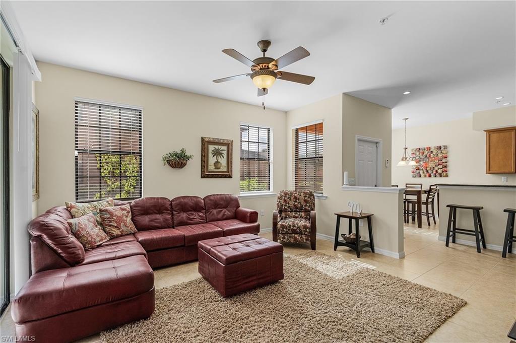 3732 Pino Vista Way, Unit 2 Estero, FL 33928 - Photo 11 of 29 a living room with furniture ceiling fan and a window