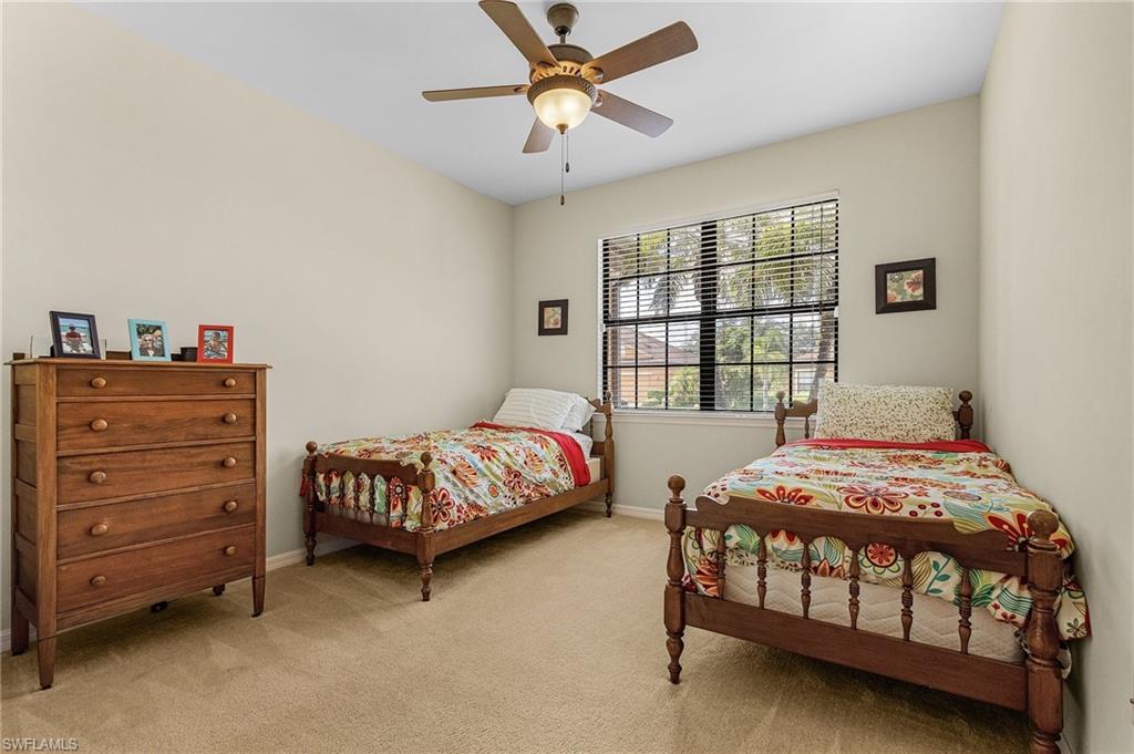 3732 Pino Vista Way, Unit 2 Estero, FL 33928 - Photo 14 of 29 a bedroom with a bed and a window