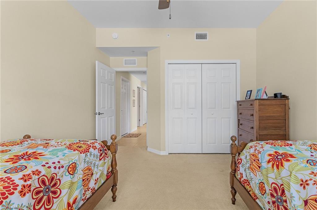 3732 Pino Vista Way, Unit 2 Estero, FL 33928 - Photo 15 of 29 a bedroom with a bed and dresser