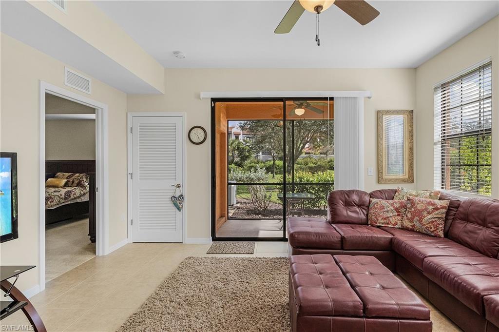 3732 Pino Vista Way, Unit 2 Estero, FL 33928 - Photo 16 of 29 a bedroom with furniture and large windows