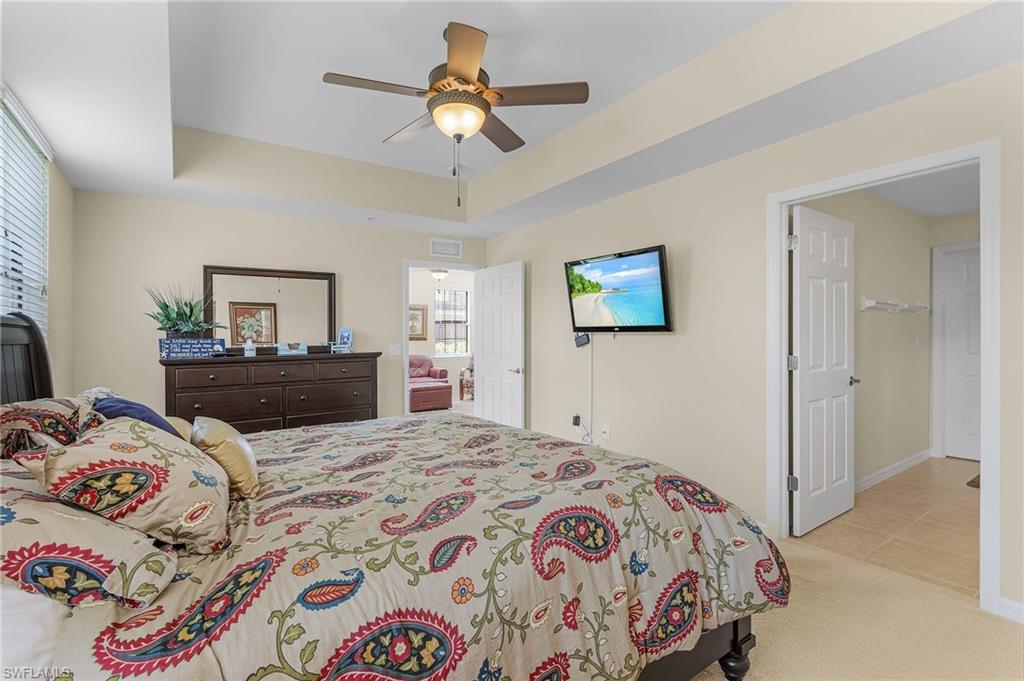 3732 Pino Vista Way, Unit 2 Estero, FL 33928 - Photo 18 of 29 a bedroom with a bed and dresser