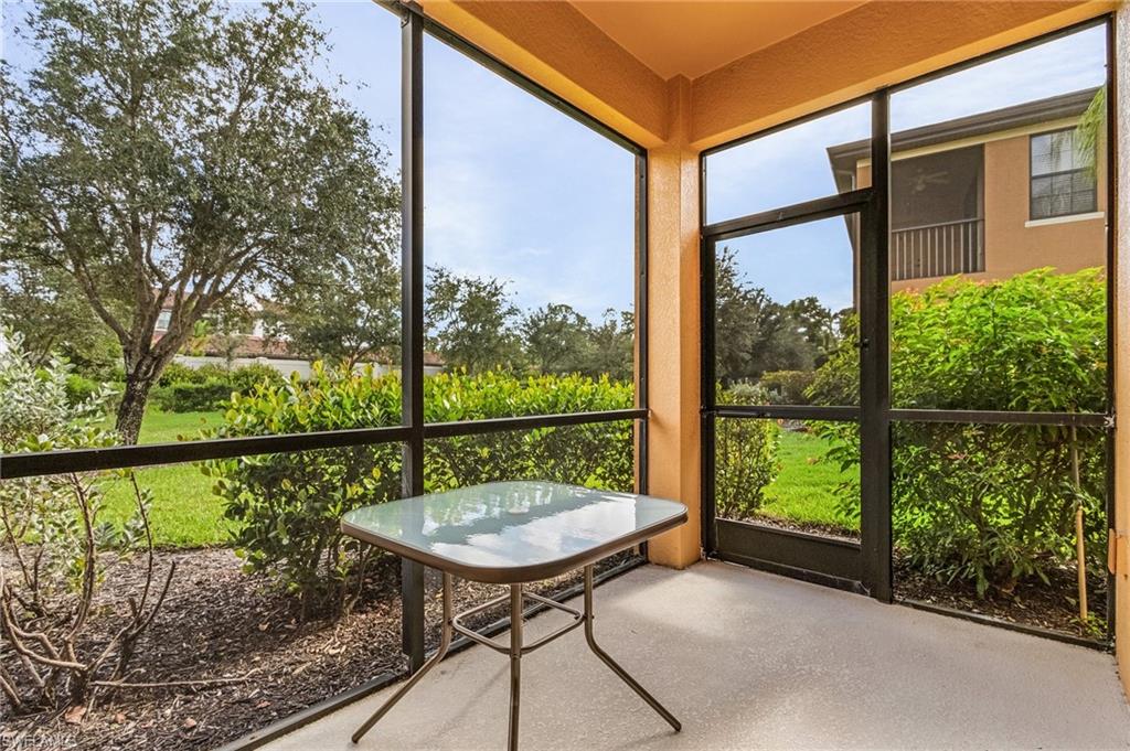 3732 Pino Vista Way, Unit 2 Estero, FL 33928 - Photo 20 of 29 a view of a chairs and table in patio of the house